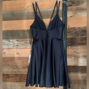This is a short Midnight blue Dress that has pockets on the side